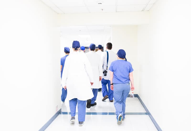 nurses and doctors walking